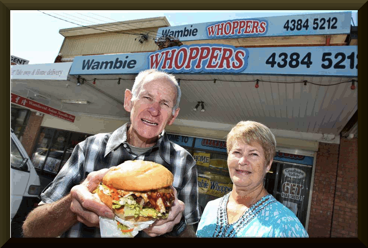 image of Creators of the Wambie Whopper Kevin and Maree Dean outside the Wamberal take-away shop. Picture: Phil Hearne